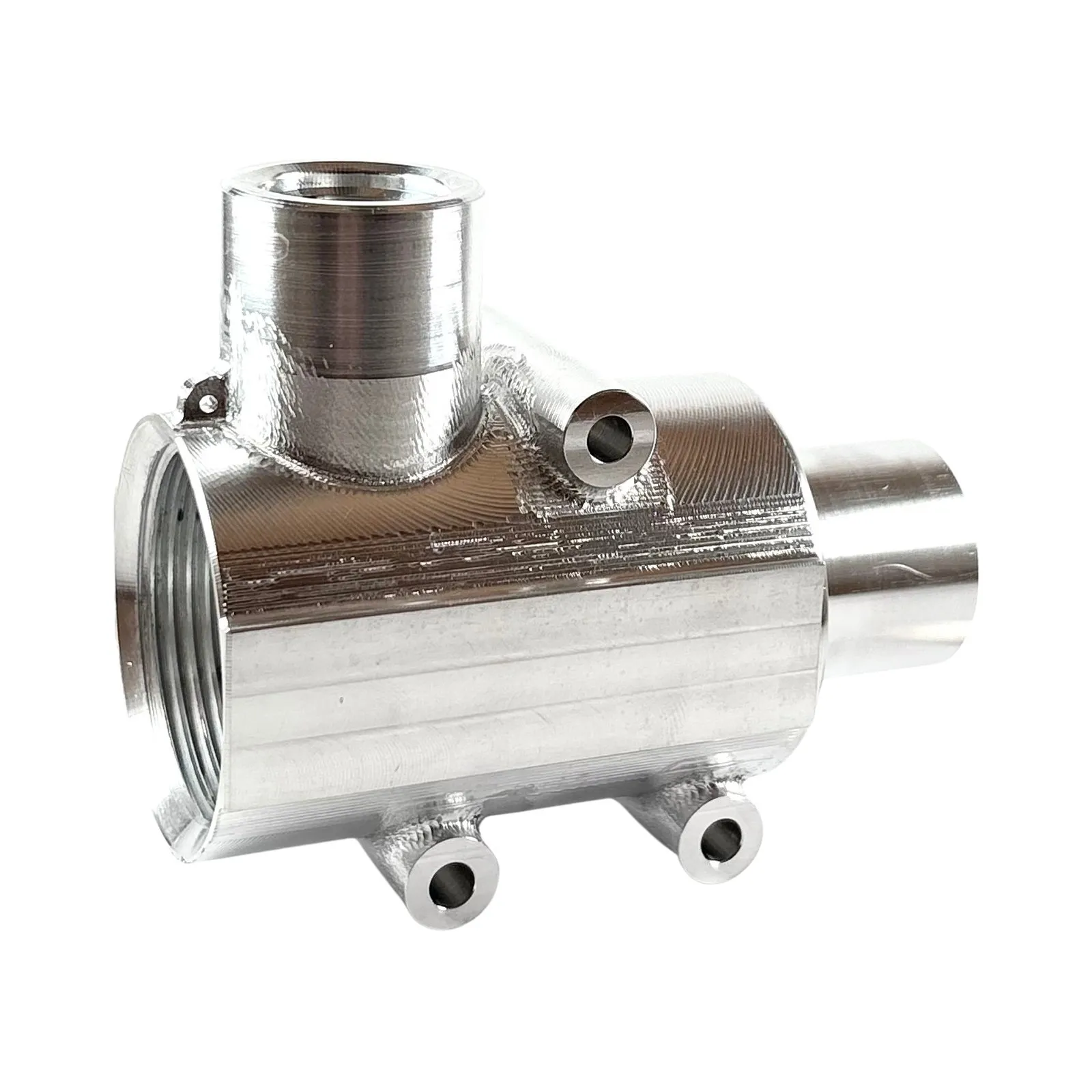 A complex machined aluminum manifold body with a threaded bore, stepped spigot, and multiple ports — milled and turned complete