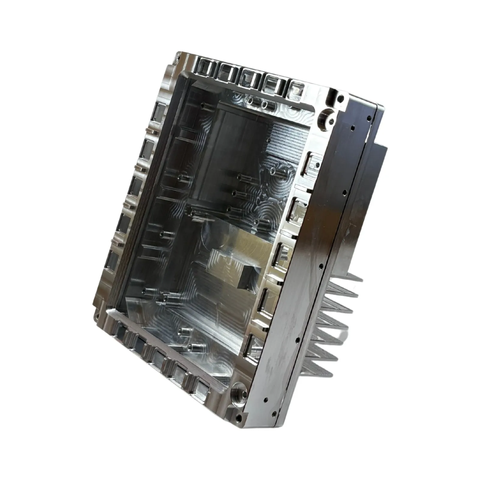 A bright-machined aluminum enclosure with internal ribbed pockets and an integral cooling-fin array