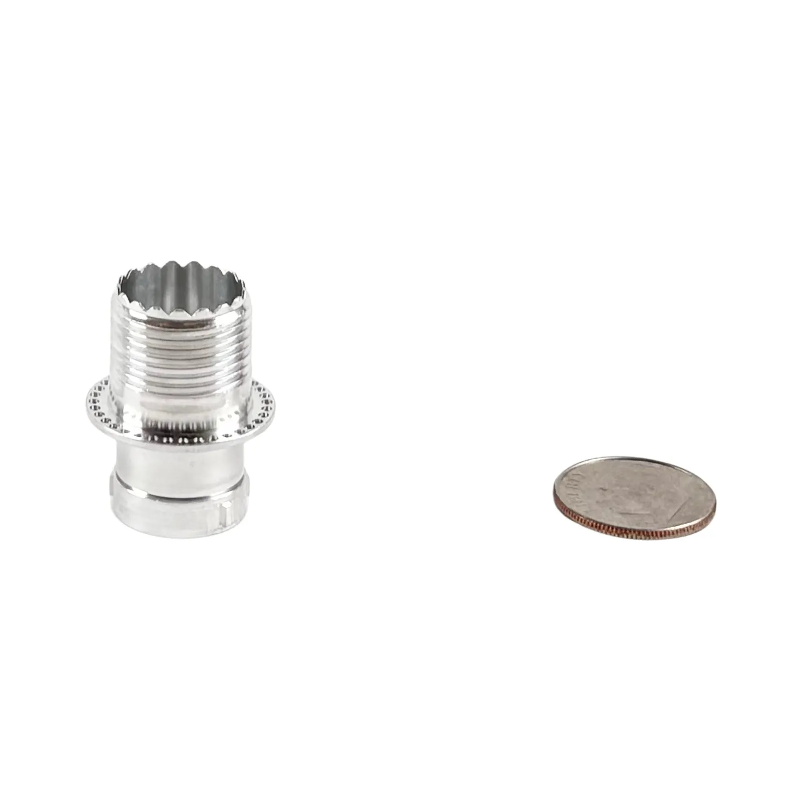A Swiss-turned stainless steel flanged bushing with external threads and a splined head, shown with a dime for scale